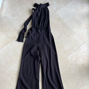 Black wide leg. Open back. Halter black jumpsuit.